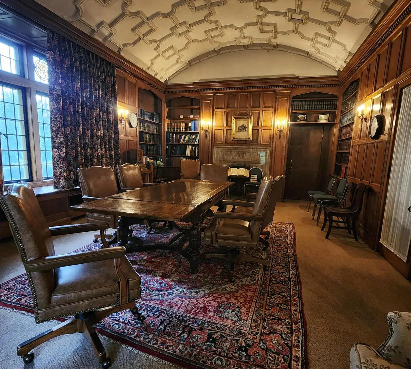 Group therapy room elegant library with wooden table and chairs